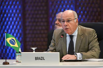 Mauro Vieira speaking at a multilateral meeting behind a nameplate reading Brazil, with a small Brazilian flag